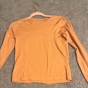 Lululemon Long sleeve cropped swiftly tech in Orange!!! No tags but rarely worn